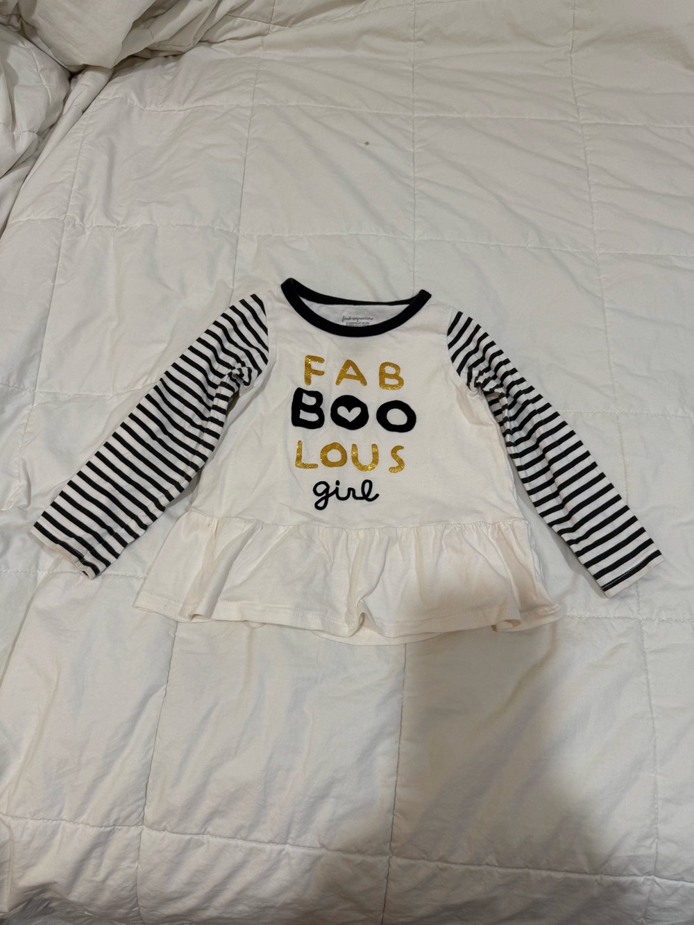 First Impressions White Peplum Top with Black Striped Sleeves and Gold Accent